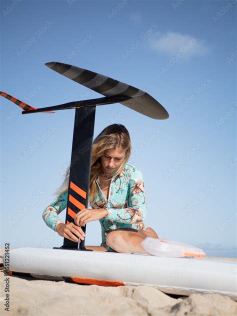 Setting up the hydrofoil surfboard Stock Photo | Adobe Stock