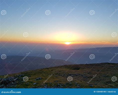 Mountain top sunrise stock photo. Image of looking, sunset - 130448148