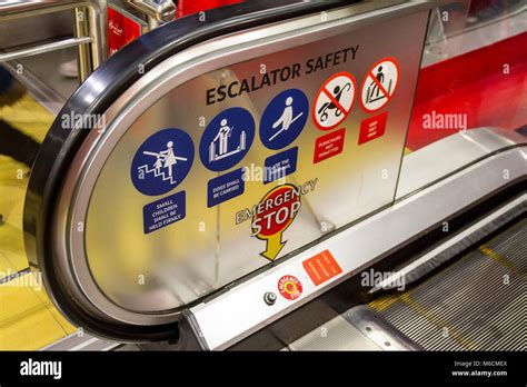 Security, Safety signs on an escalator in a shop, London UK Stock Photo - Alamy