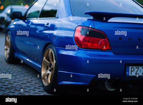 Blue Subaru Impreza WRX Blobeye with gold wheels and smoked taillights ...