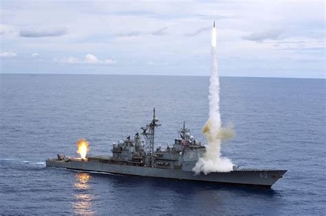 Ticonderoga-class guided-missile cruiser USS Cowpens (CG 63) fires Standard Missiles at an ...