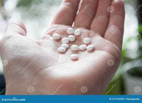 Very Small White Round Pills Stock Image - Image of emotion, laid: 107754299