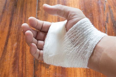 White Bandage On Injury Hand Stock Photo - Download Image Now - iStock