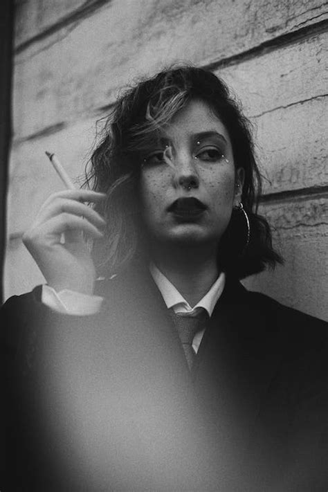 Black and White Portrait of Woman Smoking Cigarette · Free Stock Photo