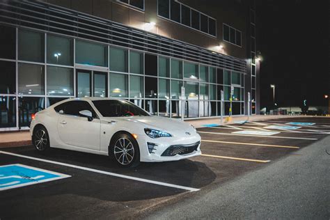 Modern car parked near building · Free Stock Photo