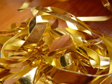 Free Image of Close up Gold Foil Cuttings on the Table | Freebie.Photography