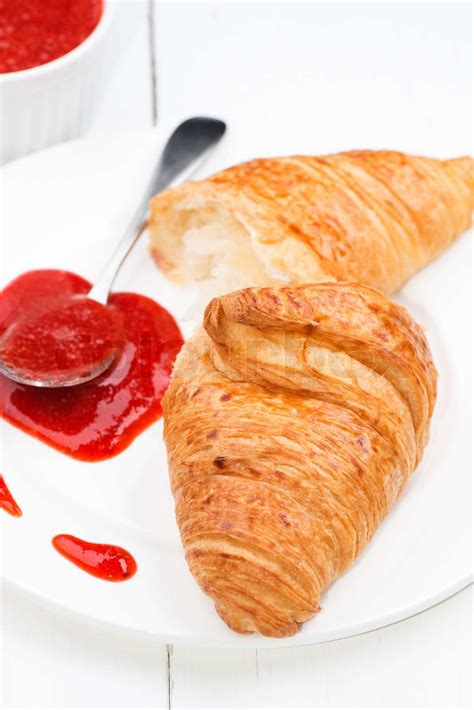 Croissant and strawberry jam | Stock image | Colourbox