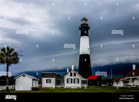 tybee island beach lighthouse with thunder and lightning Stock Photo ...