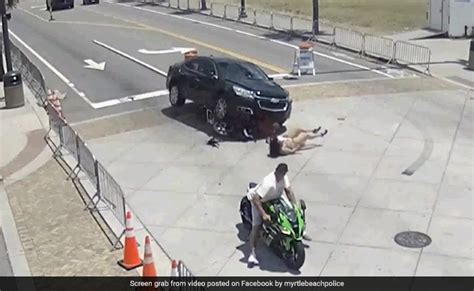 Dramatic Video Shows Bystanders Lifting Car To Rescue Motorcyclist ...