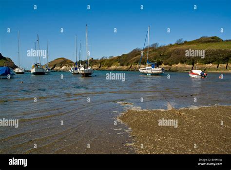 On the shingle beach between the boats at Watermouth Cove North Devon UK Stock Photo - Alamy