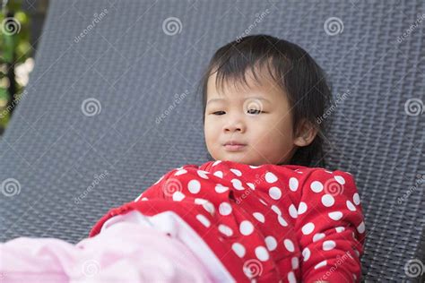 Asian Cute Girl Kid is Boring on Modern Sofa. Stock Photo - Image of person, asia: 115202436