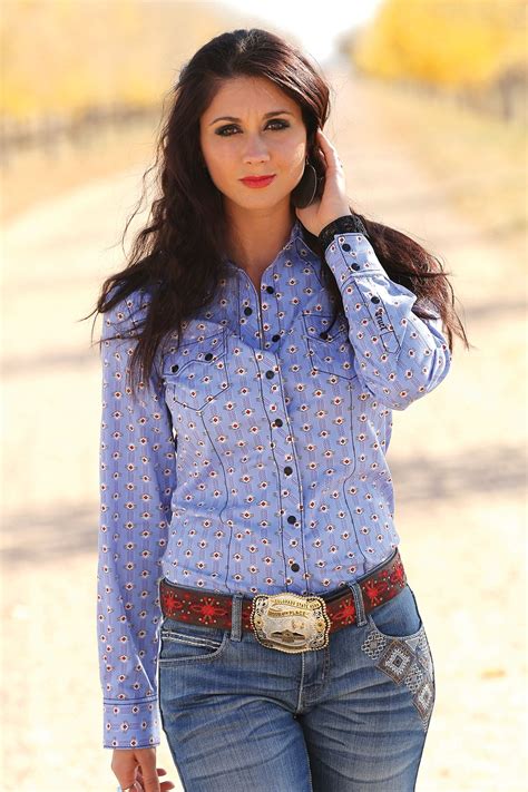 This cute country button-up will have everyone staring, as timeless western wear is paired with ...