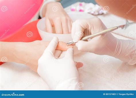 Manicurist Uses Professional Manicure Tool. Stock Image - Image of female, closeup: 80157483