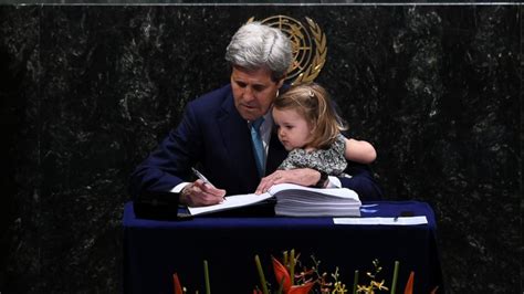 John Kerry Signs Climate Deal With Granddaughter Seated in His Lap ...