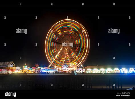 Illuminated colourful ferris wheel, Central Pier; Blackpool, Lancashire ...