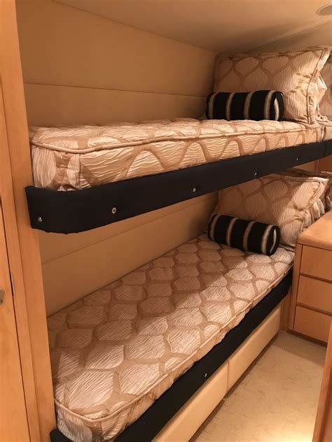 Yacht side berth with bunk beds. We prefer the drops tuck down behind the keeper rail.