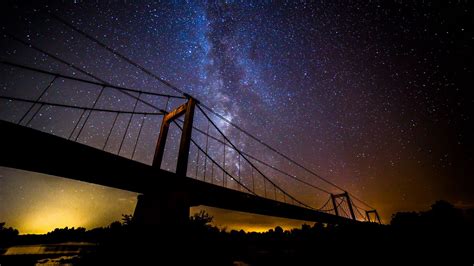 Download wallpaper 1366x768 bridge, milky way, night, stars, dark ...