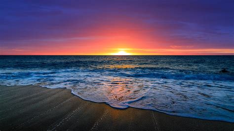 Nice Beautiful Ocean Waves Beach Sand In Purple Red Clouds Sky ...