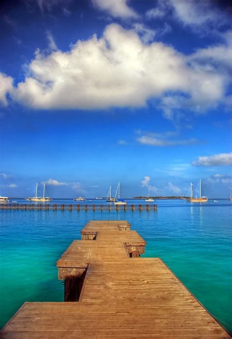 Landscapes Ocean | Free Stock Photo | View from a wooden pier overlooking sailboats in the ocean ...
