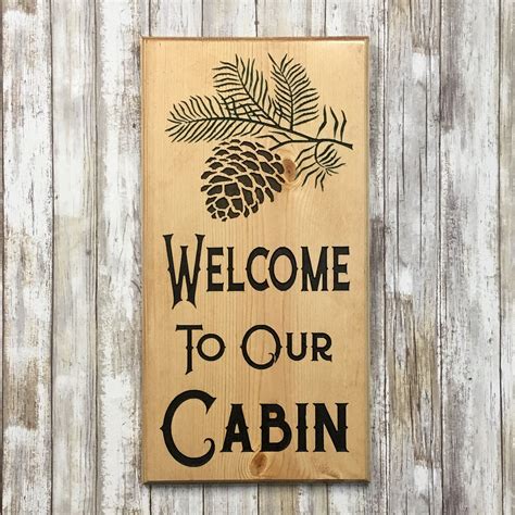 Welcome to Our Cabin Sign - - Pinecone Branch - Carved Pine Wood | Cabin signs, Wood cabin signs ...