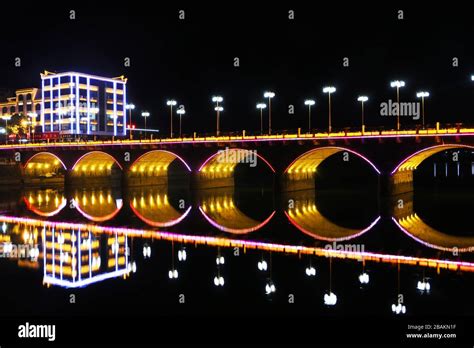 Stone arch bridge in the night Stock Photo - Alamy