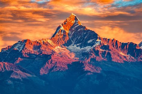 Premium Photo | Beautifull cloudy sunrise in the mountains with snow ridge fron Himalaya view ...