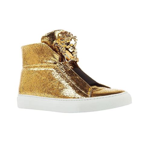 These iconic sneakers in gold laminated leather are both luxurious and ...