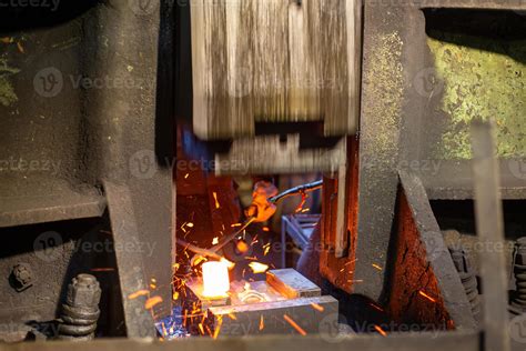 close-up picture of hot steel forging process with big mechanical ...