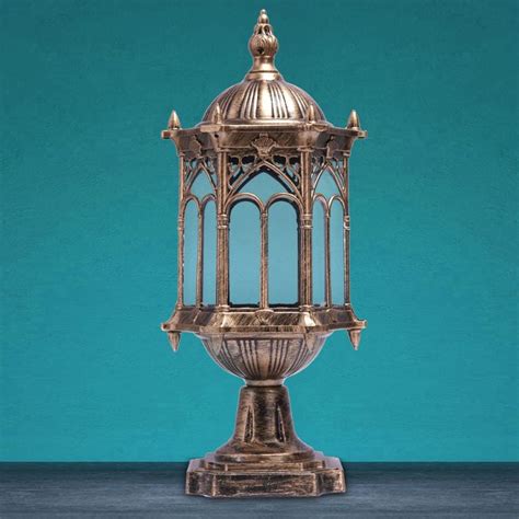 an antique brass birdcage on a blue background