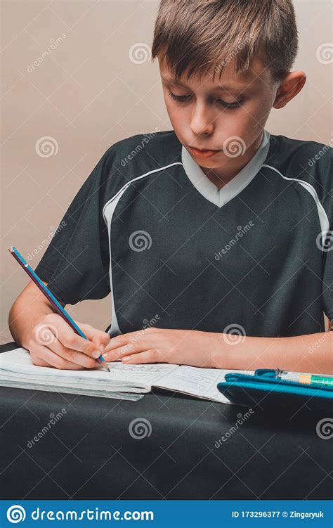 A Boy Sits at a Table and Draws Pencils on White Paper Stock Image - Image of drawing, face ...