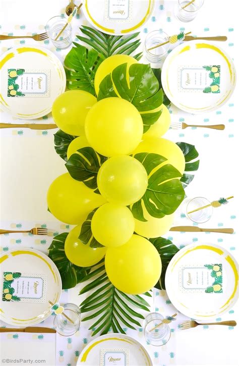 DIY Balloon & Fronds Tropical Party Centerpiece - Party Ideas | Party Printables Blog