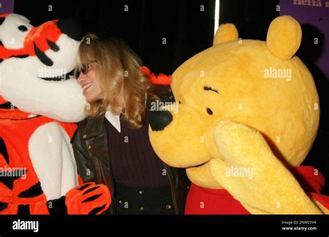 Carly Simon with Tigger and Winnie the Pooh at the premiere of "Pooh's Heffalump Movie" at Loews ...