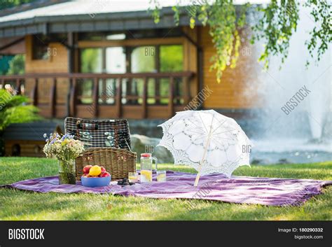 Beautiful picnic setting on sunny day. Outdoor picnic set lying on ...