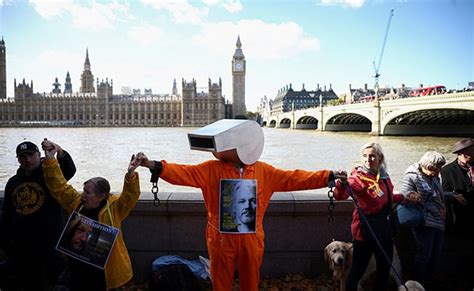 In Pics: Julian Assange Supporters Form Human Chain Outside UK Parliament