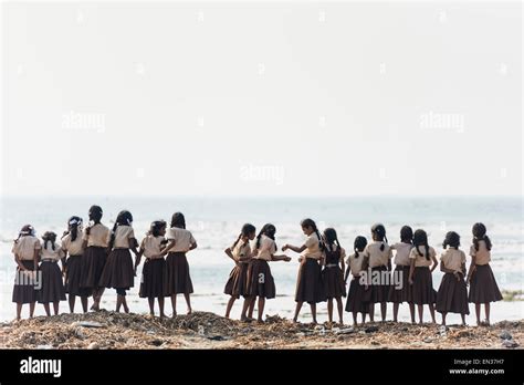 Girl school class in school uniforms at the beach, Fort Kochi, Kerala ...