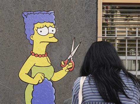 Marge Simpson joins protests outside Iranian consulate in Milan | The ...