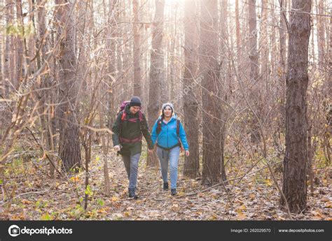 People, hike, tourism and nature concept - Couple tourist hiking in ...