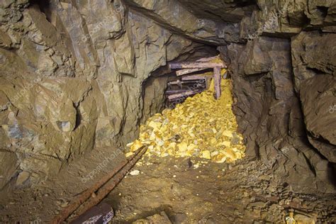 Old abandoned underground gold mine tunnel Stock Photo by ©mishainik 129162354