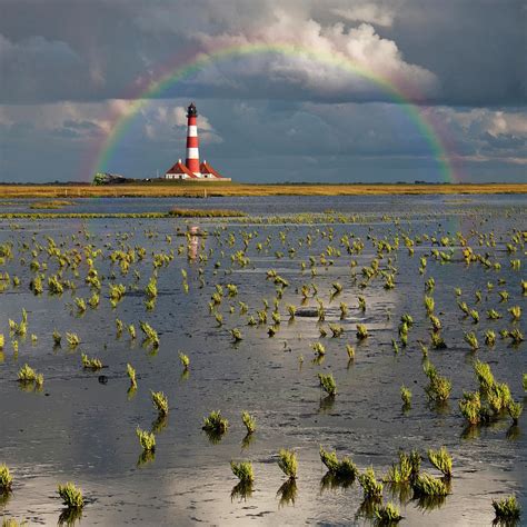 Lighthouse Meets Rainbow Photograph by Carsten Meyerdierks - Pixels