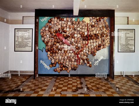 Cambodia filled with skulls. Mural in Tuol Sleng Memorial. The Tuol Sleng Genocide Museum is the ...