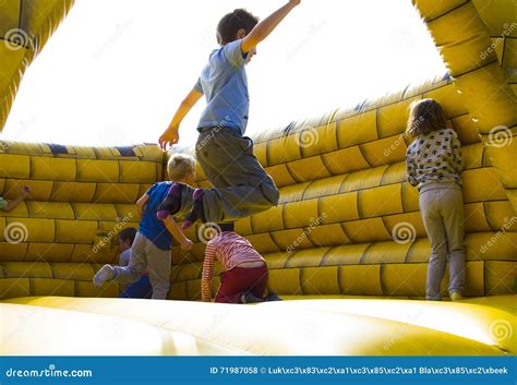 Kids jumping editorial stock photo. Image of grass, jump - 71987058