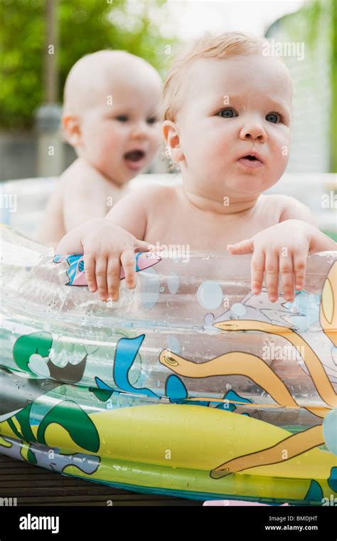 Two Babies in Inflatable Pool Stock Photo - Alamy