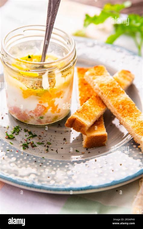 Coddled eggs with ham, cheese and toast soldiers (England Stock Photo ...