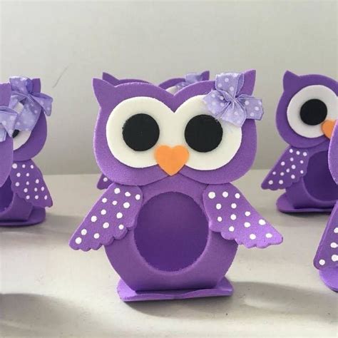 three purple owls with white polka dots on them