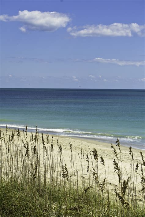 Emerald Isle NC....a brisk ocean breeze in your face and hot sand under ...