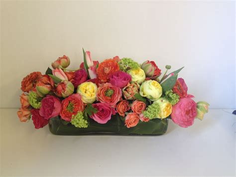 Centerpiece Option 1 - long rectangular vase filled with tailored bouquet of spring florals ...