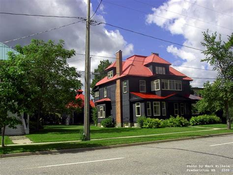 #black house #red roof. Looks great against the super green lawn | Gray house exterior, Green ...