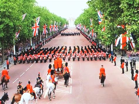 an image of a parade going down the street with people on horses and in uniform