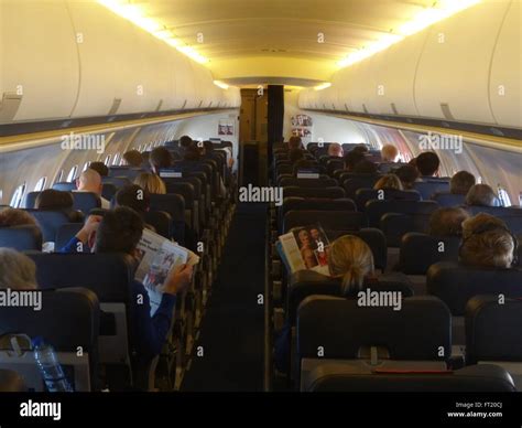 Aircraft interior, passengers Stock Photo - Alamy