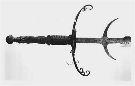 A German two-handled sword with a long, undulating steel blade and ...